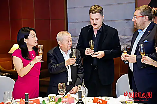 Josip raising a toast with Chinese business partners after closing a deal