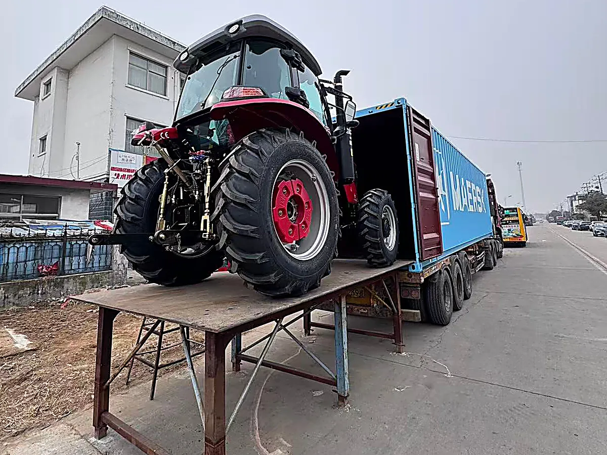 Loading tractors into a container